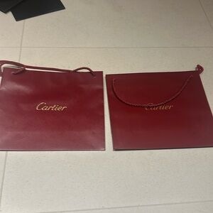 Two medium sized Cartier bags